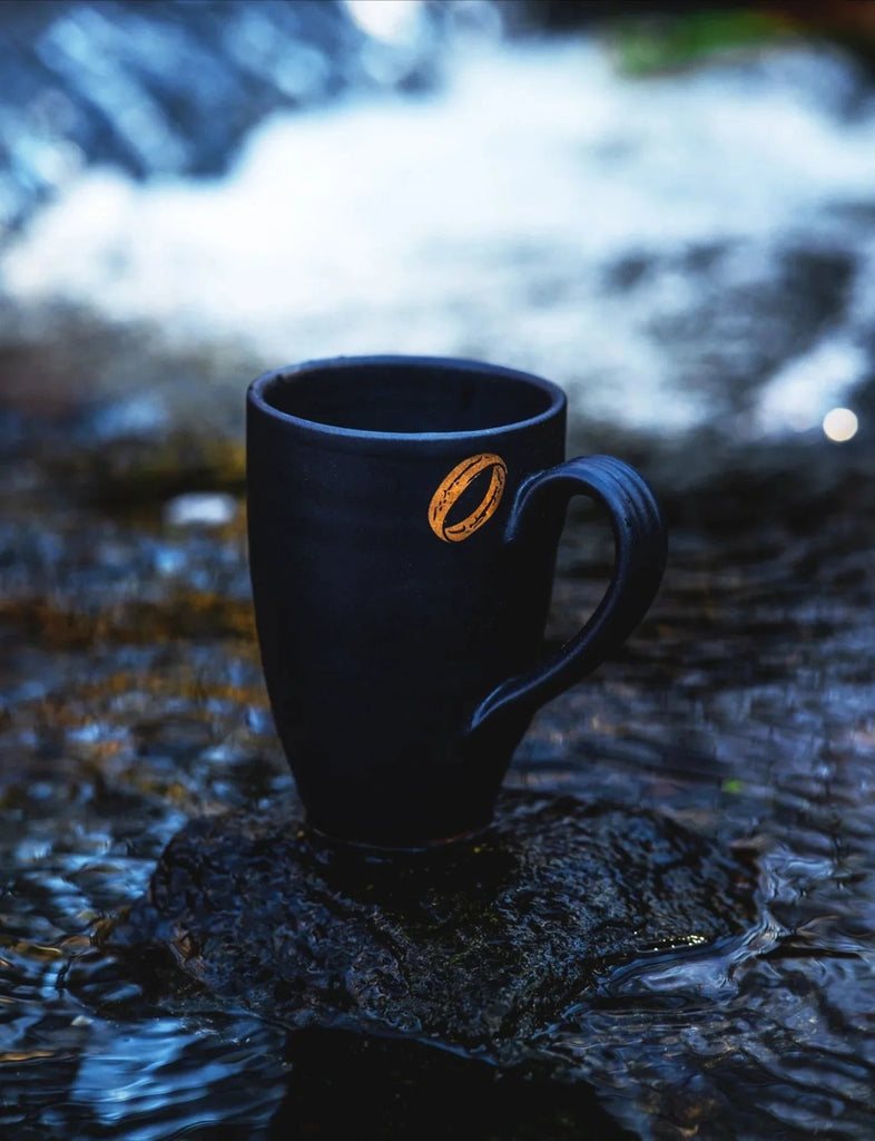 lord of the rings inspired hero mug, in fortress black satin glaze with 22k gold ring near the handmade handle by donovan pottery